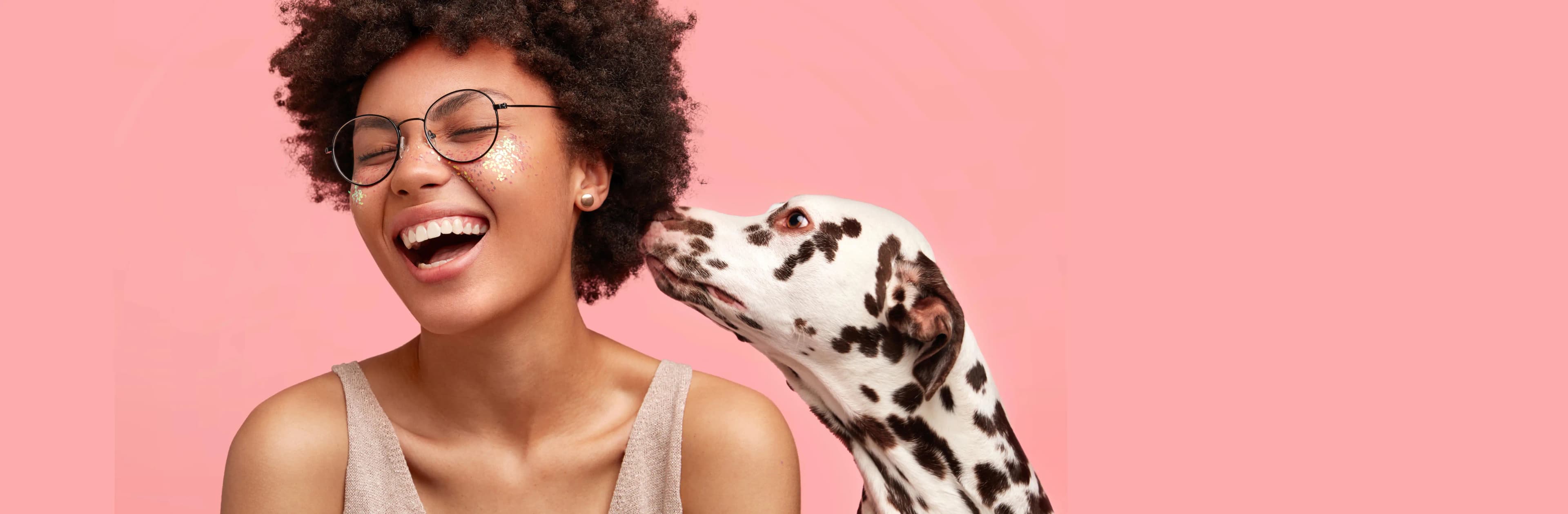 Happy woman with dalmatian dog
